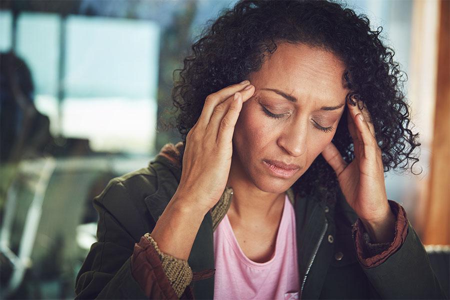 Woman experiencing a bad headache