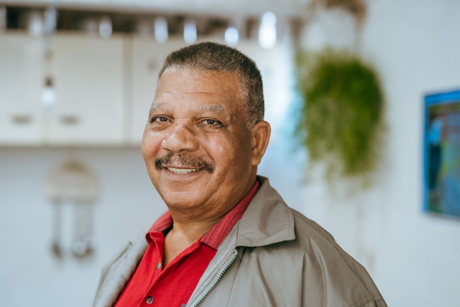 Man smiling red shirt