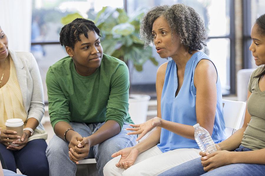 Woman talking in heart failure support group meeting