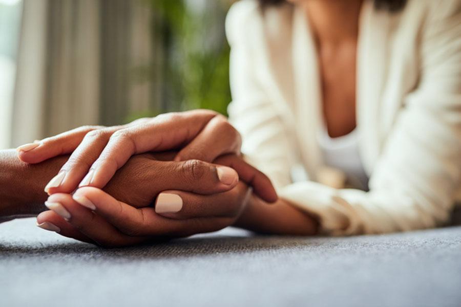 Closeup of two hands clasping