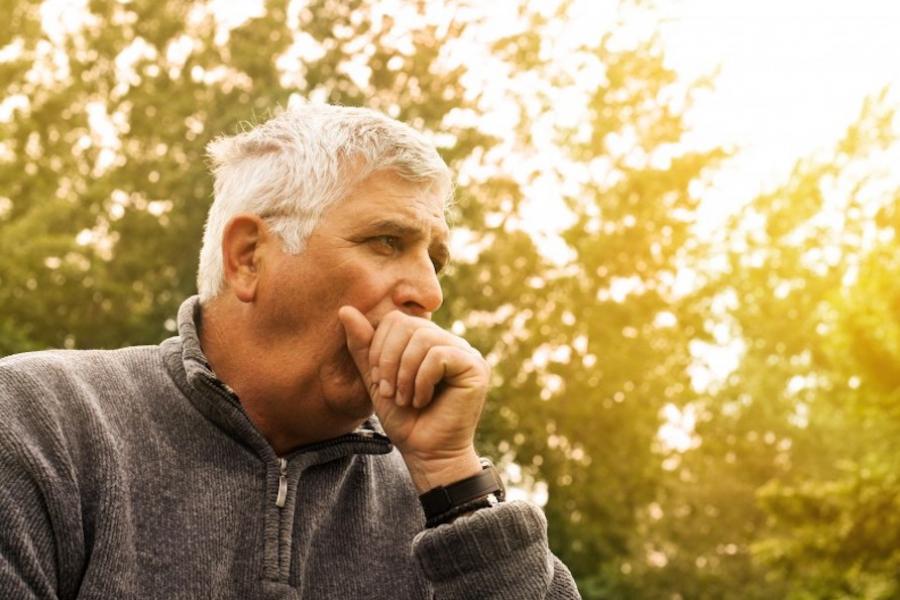 Man coughing outside