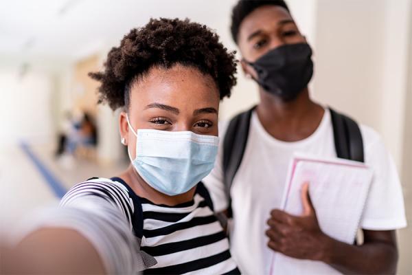 Young children wearing face masks at school