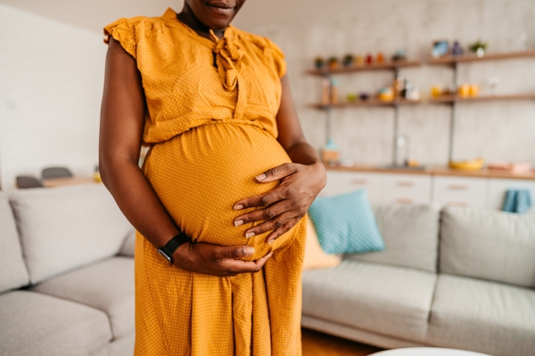 Pregnant woman holding stomach